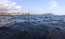 About to submerge...Diamond Head off Waikiki. by Glenn Poulain 
